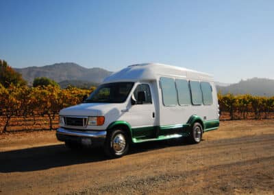 tour bus with vineyards behind