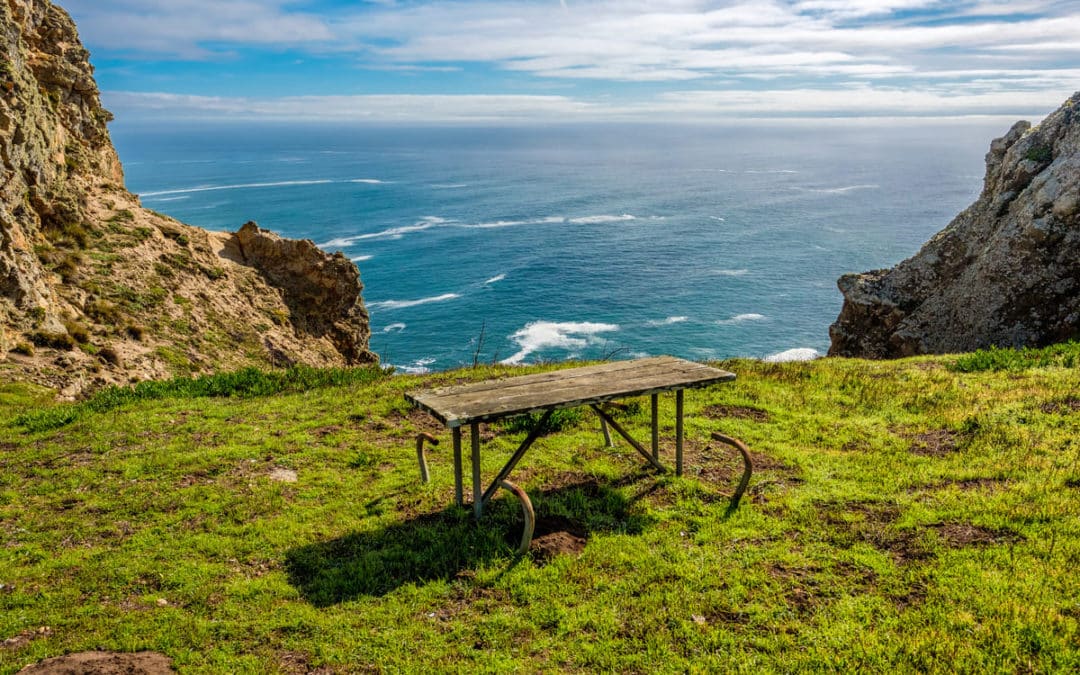 picnic table by ocean