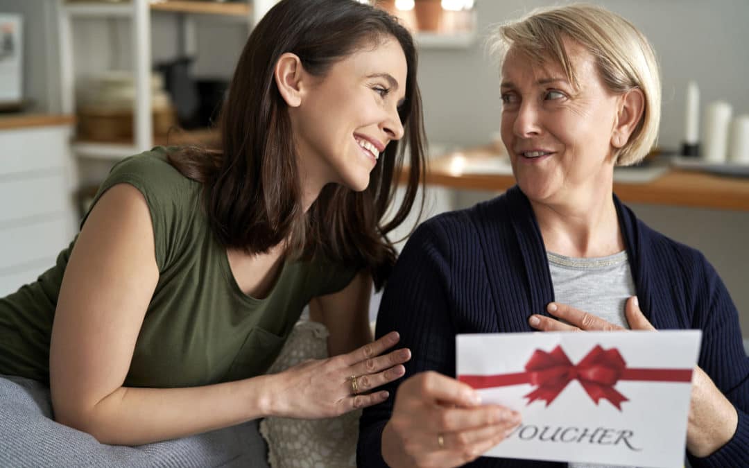 two women holding a card