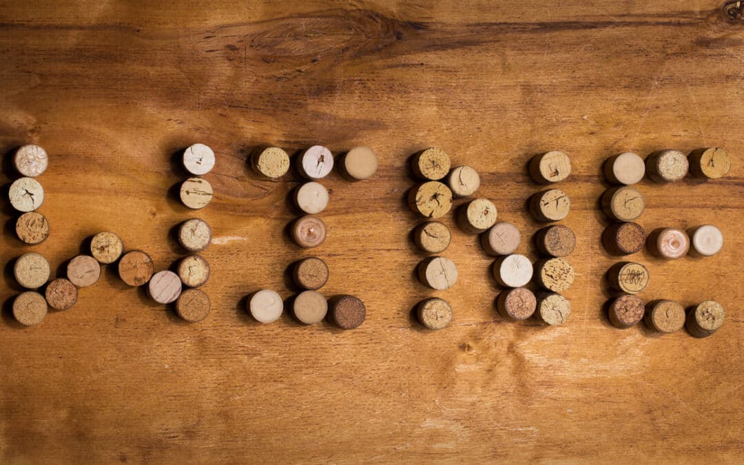 wine spelled out in corks on table