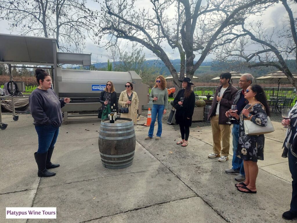 people standing around wine tasting