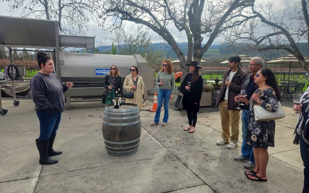 people standing around wine tasting