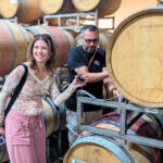 Behind-the-scenes winery experience in Napa Valley as a visitor samples wine directly from the barrel with a host.