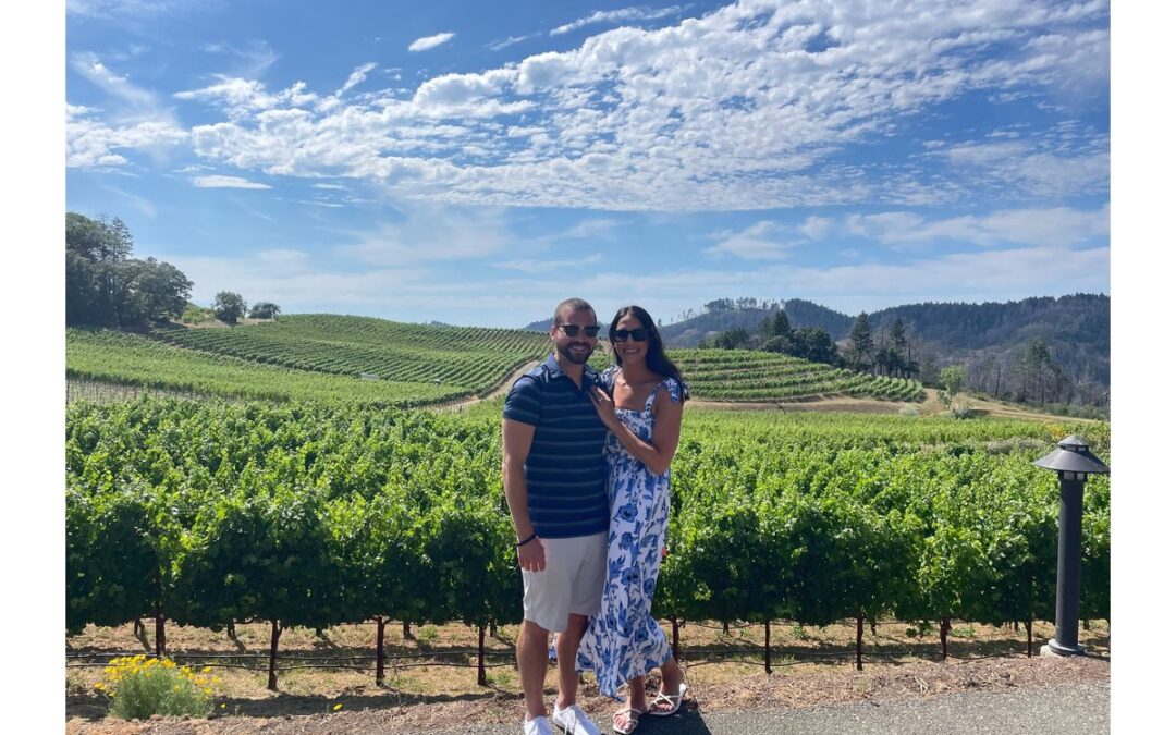 Couple enjoying a private wine tour with vineyard views in Napa Valley