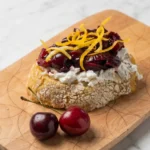 Cherry compote with goat cheese and lemon zest on sourdough bread