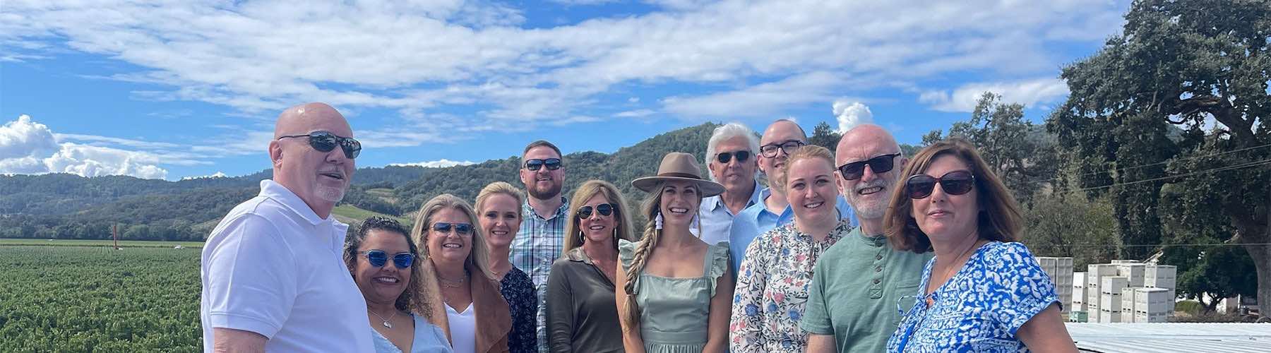 Smiling Platypus Wine Tours guests posing together during a small-group wine country tour.